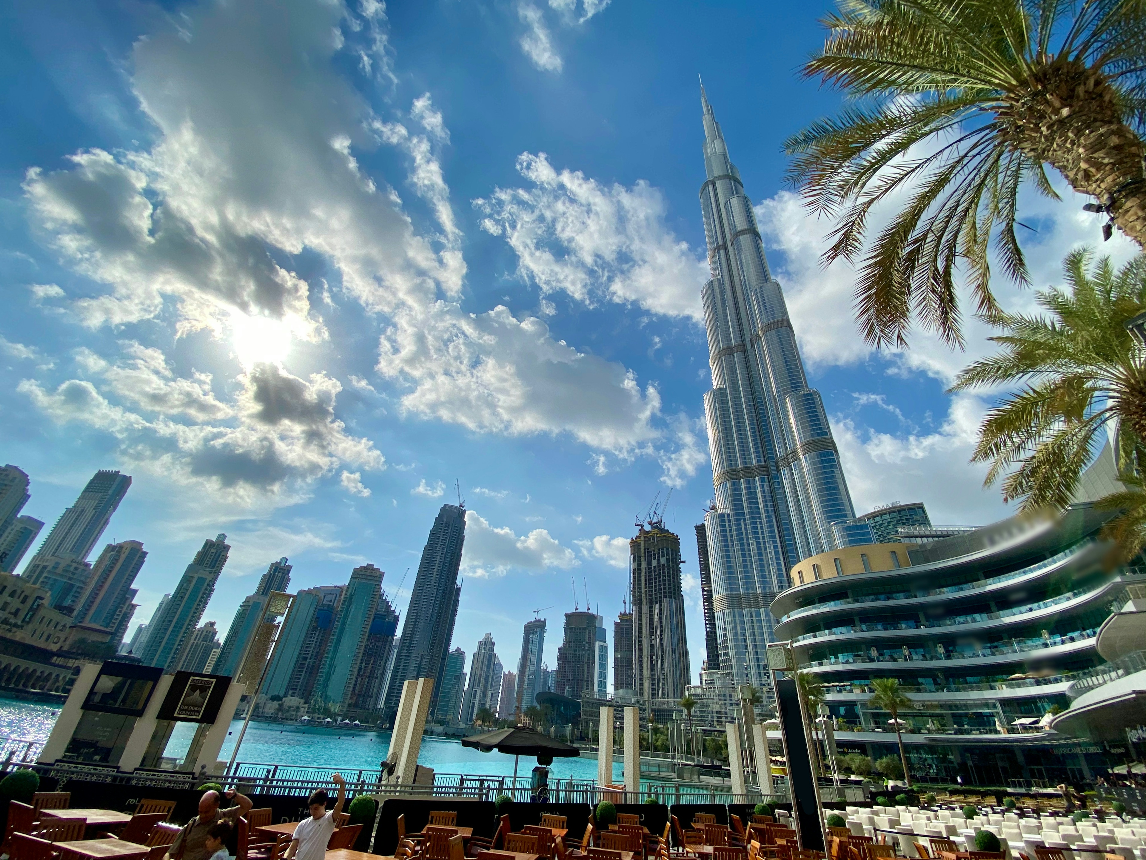 Burj Khalifa Level 148 Sky Lounge - Luxury private yacht cruising through the turquoise waters of Dubai Marina past skyscrapers