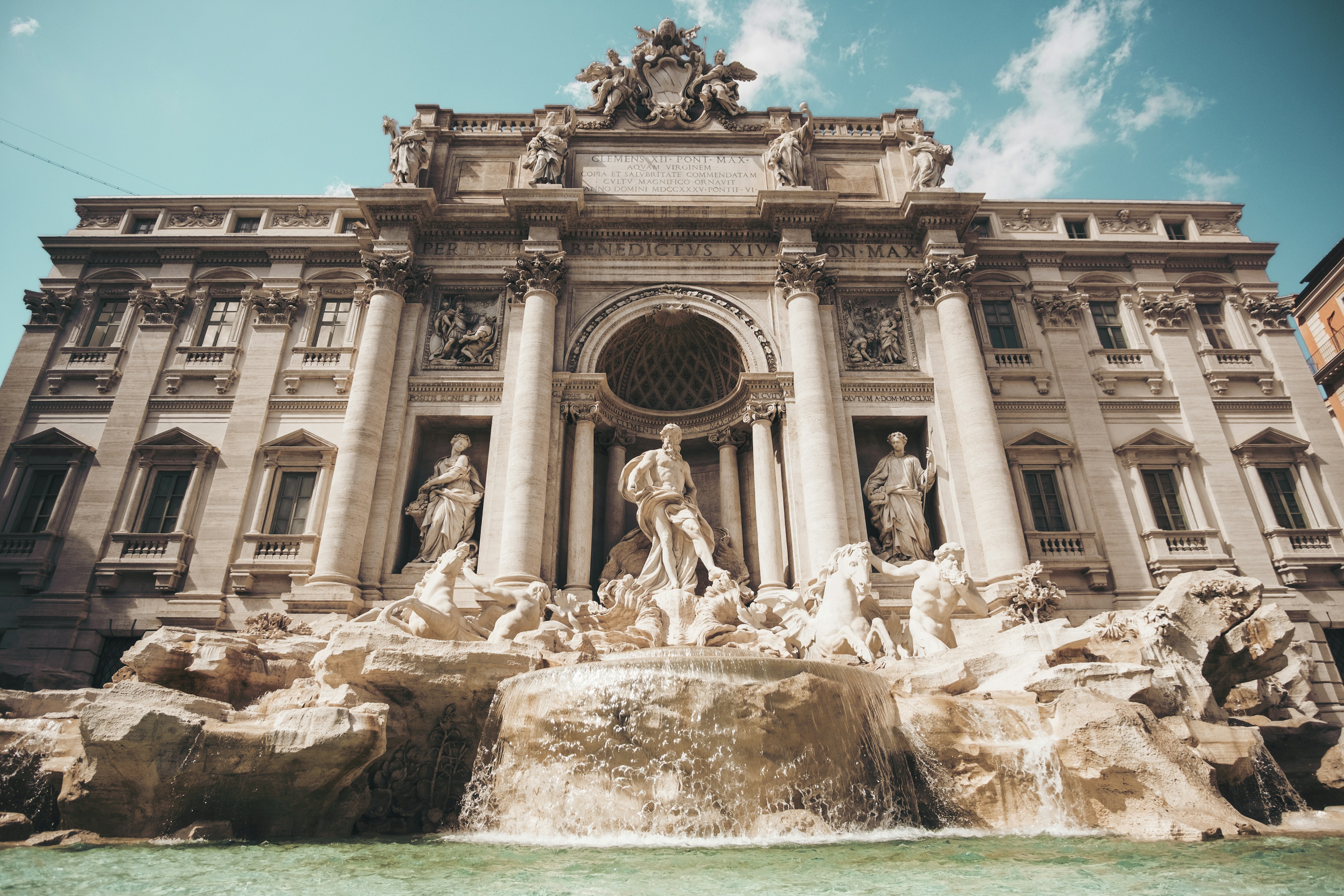 Colosseum Underground Tour Rome - Trevi Fountain in Rome with turquoise crystal waters and ornate baroque marble statues