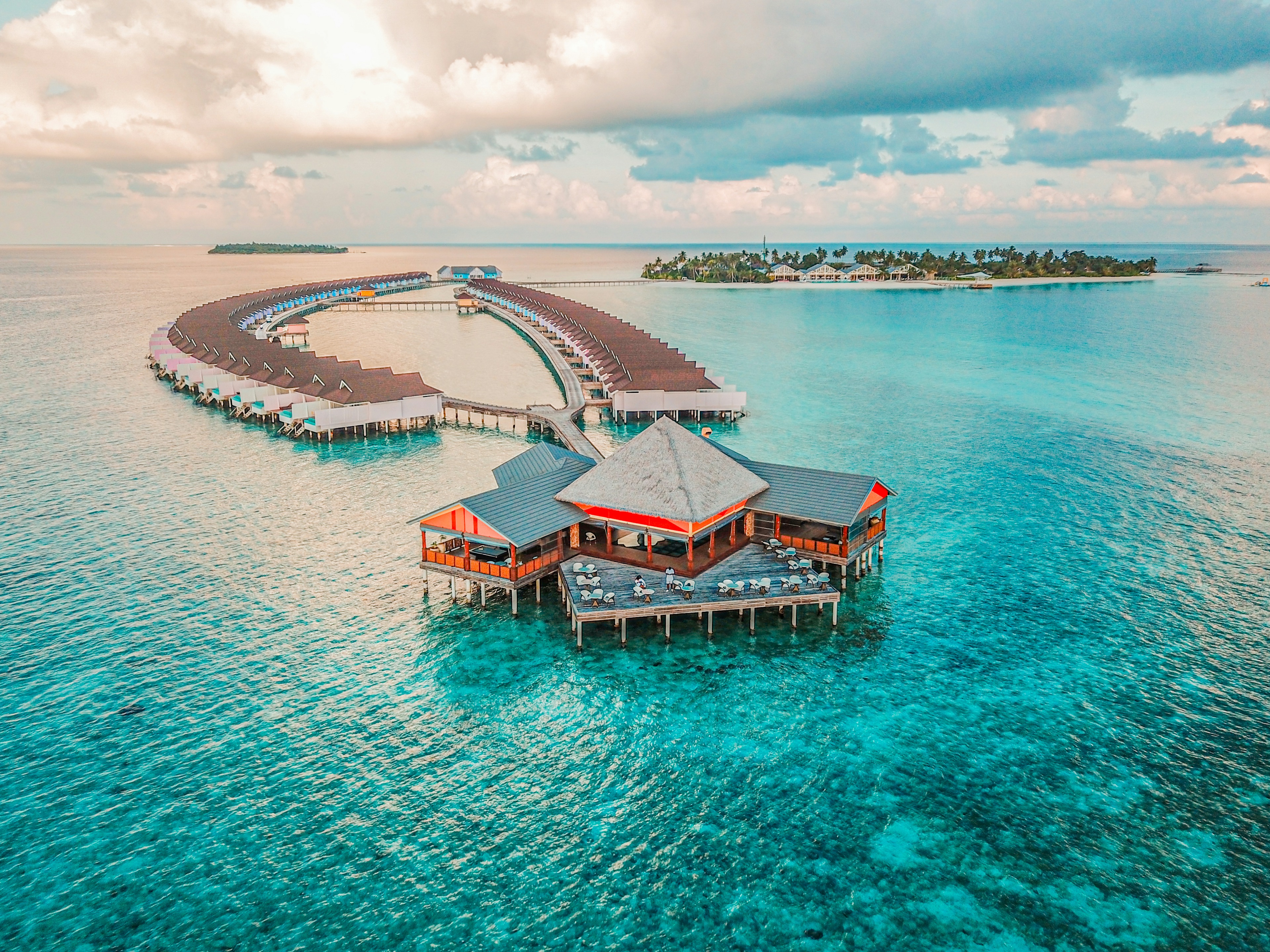 Maldives Luxury Catamaran Tour - Private overwater sundeck with sunken seating and turquoise ocean infinity pool in the Maldives